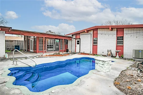 a view of swimming pool with outdoor seating