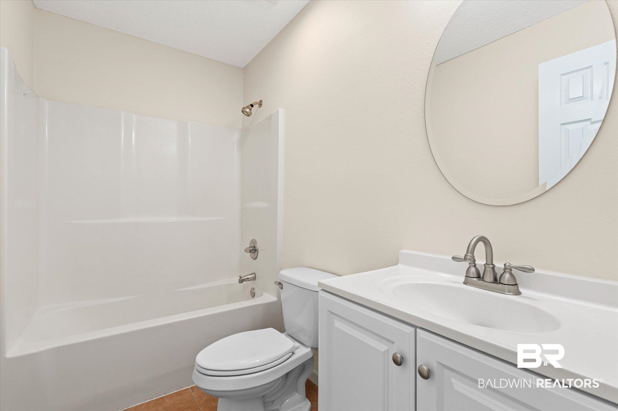 157 Bay View Drive Daphne, AL 36526 - Photo 12 of 22 Bathroom featuring vanity, shower / tub combination, and tile patterned floors