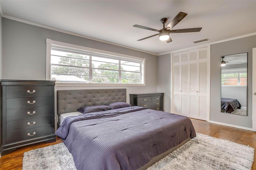 6609 Genoa Road Fort Worth, TX 76116 - Photo 23 of 39 Bedroom with a closet, dark wood-style flooring, multiple windows, crown molding, and ceiling fan