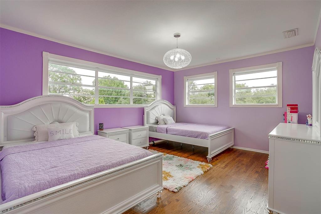 6609 Genoa Road Fort Worth, TX 76116 - Photo 24 of 39 Bedroom featuring a chandelier, crown molding, and wood finished floors