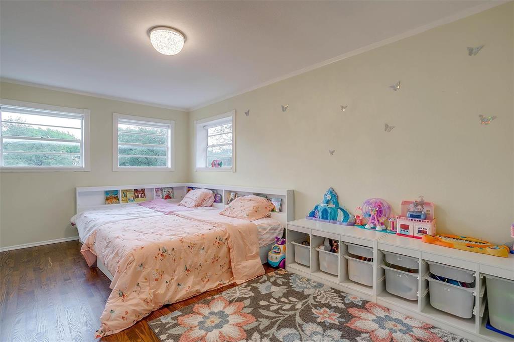 6609 Genoa Road Fort Worth, TX 76116 - Photo 26 of 39 Bedroom featuring wood finished floors and crown molding