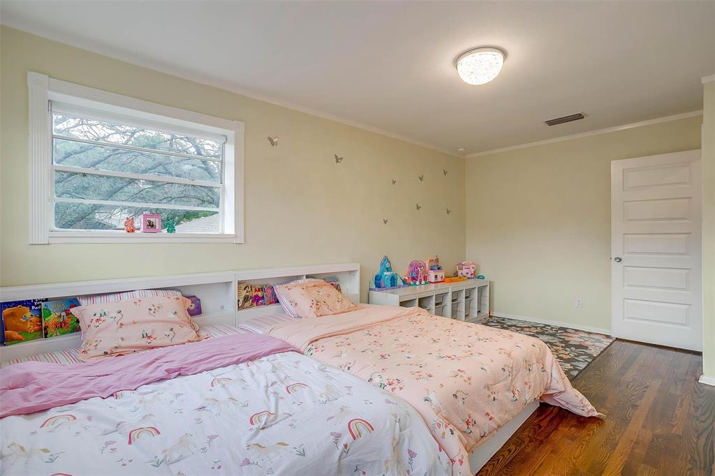 6609 Genoa Road Fort Worth, TX 76116 - Photo 28 of 39 Bedroom featuring wood finished floors and ornamental molding