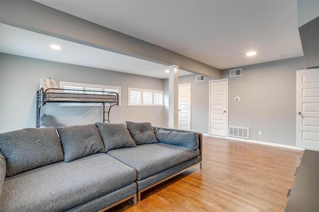 6609 Genoa Road Fort Worth, TX 76116 - Photo 30 of 39 Living room with light wood-style flooring and recessed lighting