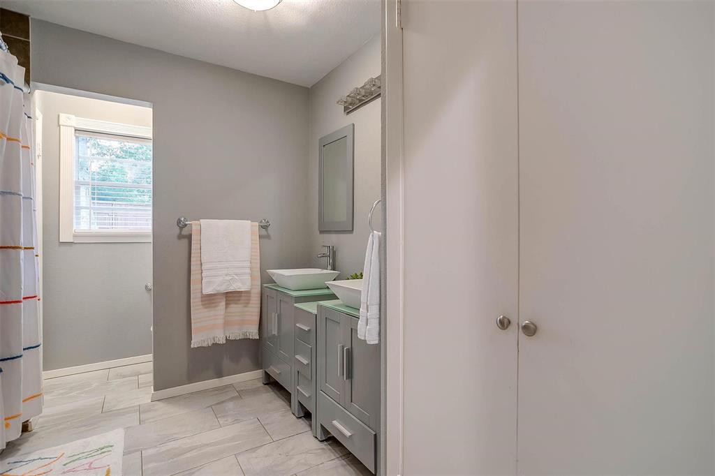 6609 Genoa Road Fort Worth, TX 76116 - Photo 33 of 39 Full bathroom featuring vanity and marble look tile flooring