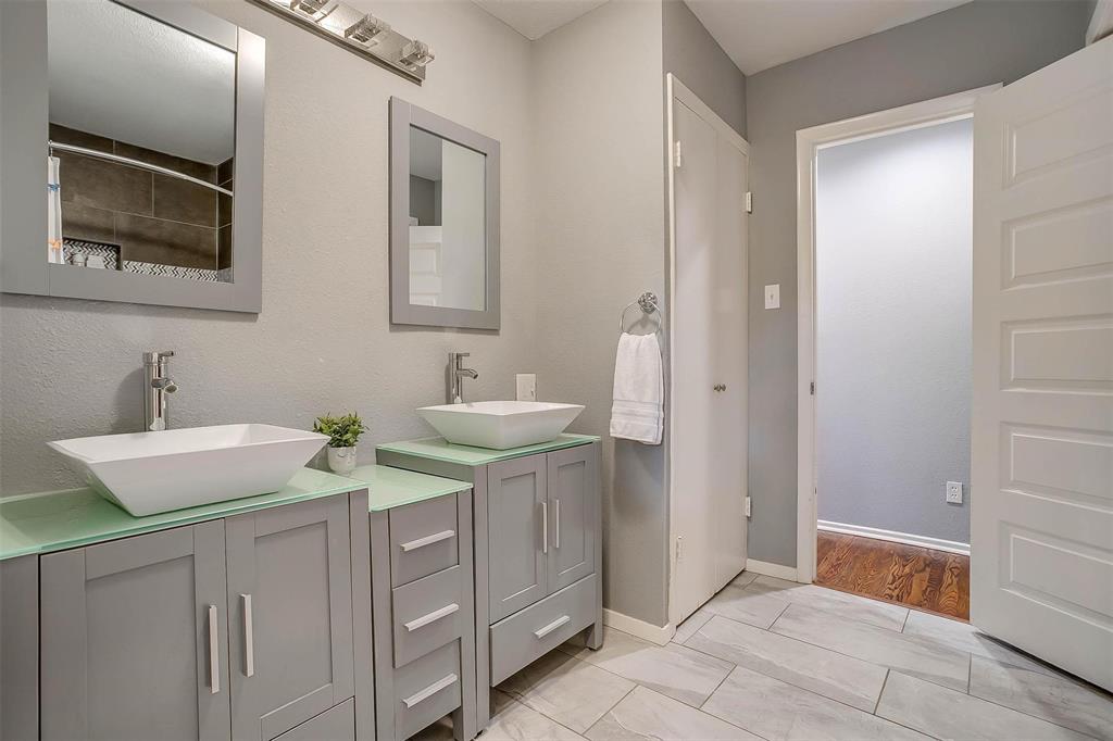 6609 Genoa Road Fort Worth, TX 76116 - Photo 34 of 39 Full bathroom with vanity and tiled shower