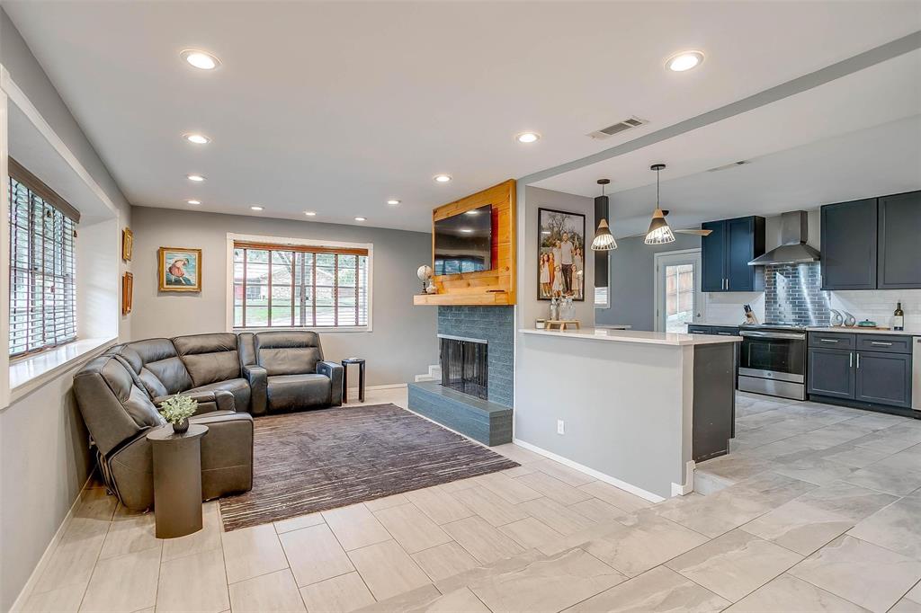 6609 Genoa Road Fort Worth, TX 76116 - Photo 6 of 39 Living room with recessed lighting and a fireplace