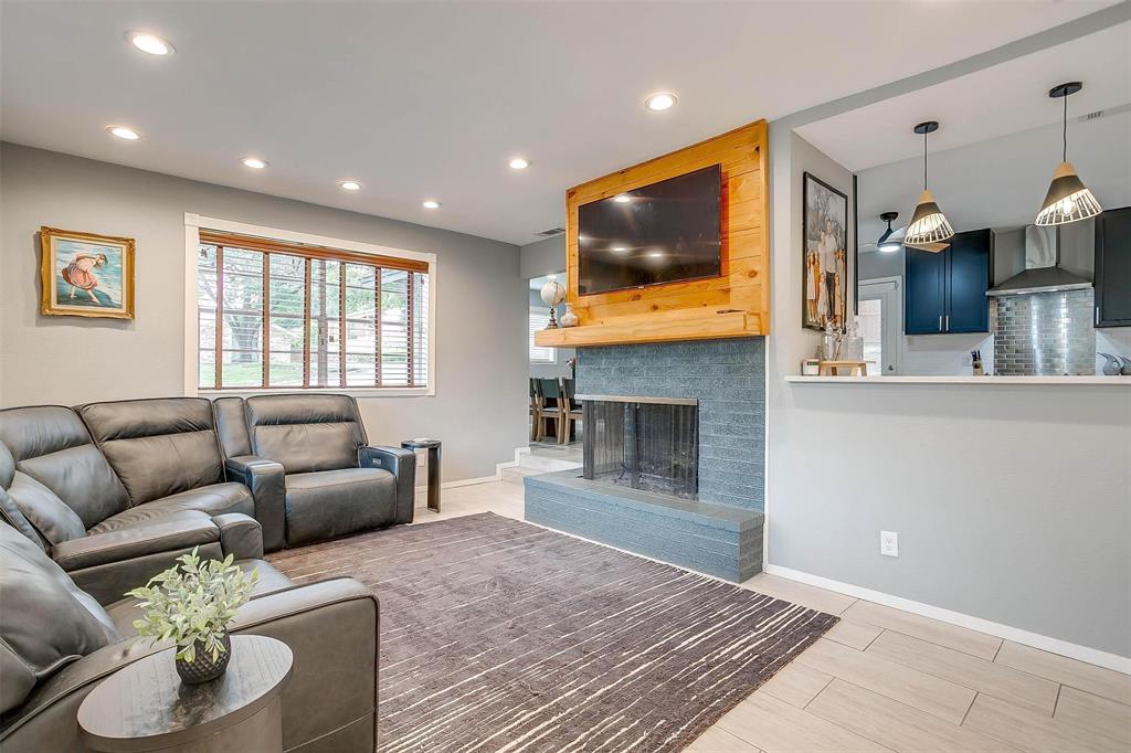 6609 Genoa Road Fort Worth, TX 76116 - Photo 7 of 39 Living area with recessed lighting and a multi sided fireplace