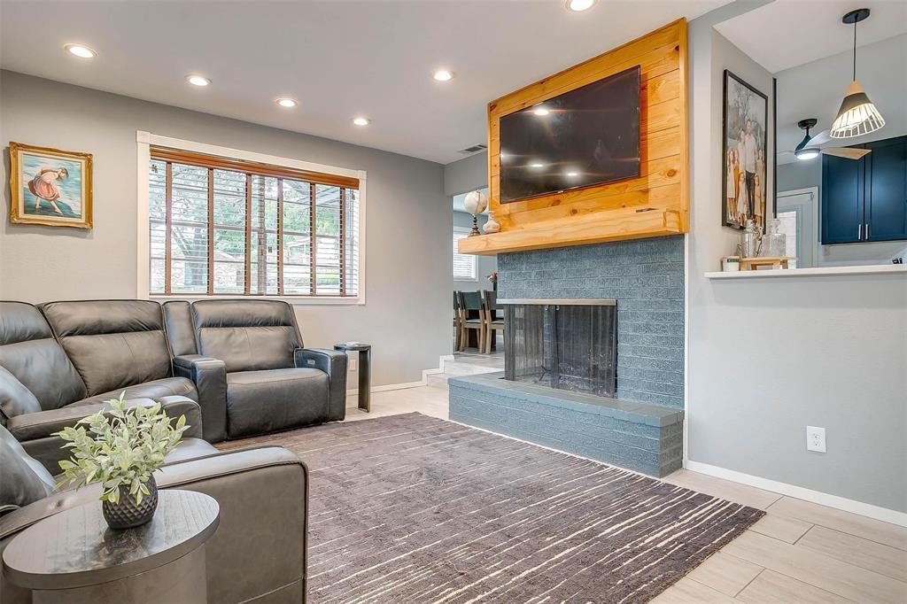 6609 Genoa Road Fort Worth, TX 76116 - Photo 8 of 39 Living area with recessed lighting and a brick fireplace
