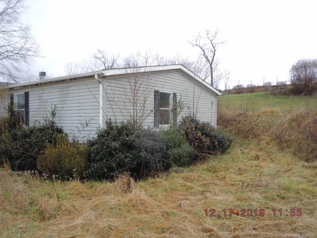 135 Austin Road Clyde, NC 28721 - Photo 2 of 9 a view of a house with a yard