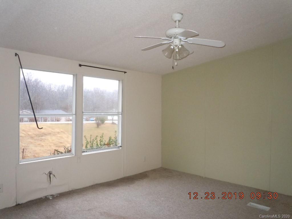 135 Austin Road Clyde, NC 28721 - Photo 7 of 9 an empty room with a window