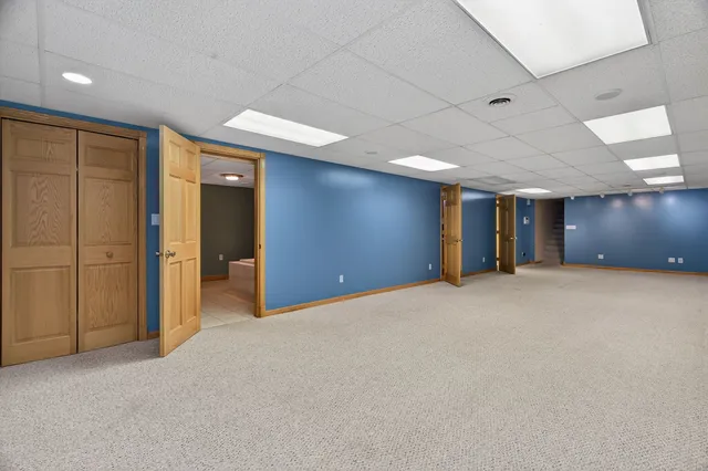 a bathroom with a bathtub sink and mirror