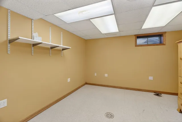a balcony with furniture and a potted plant