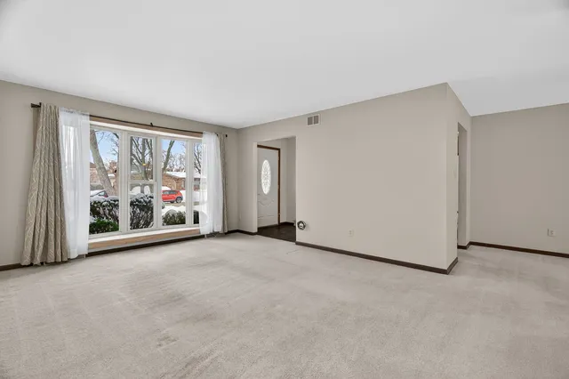 a view of a room with a large window