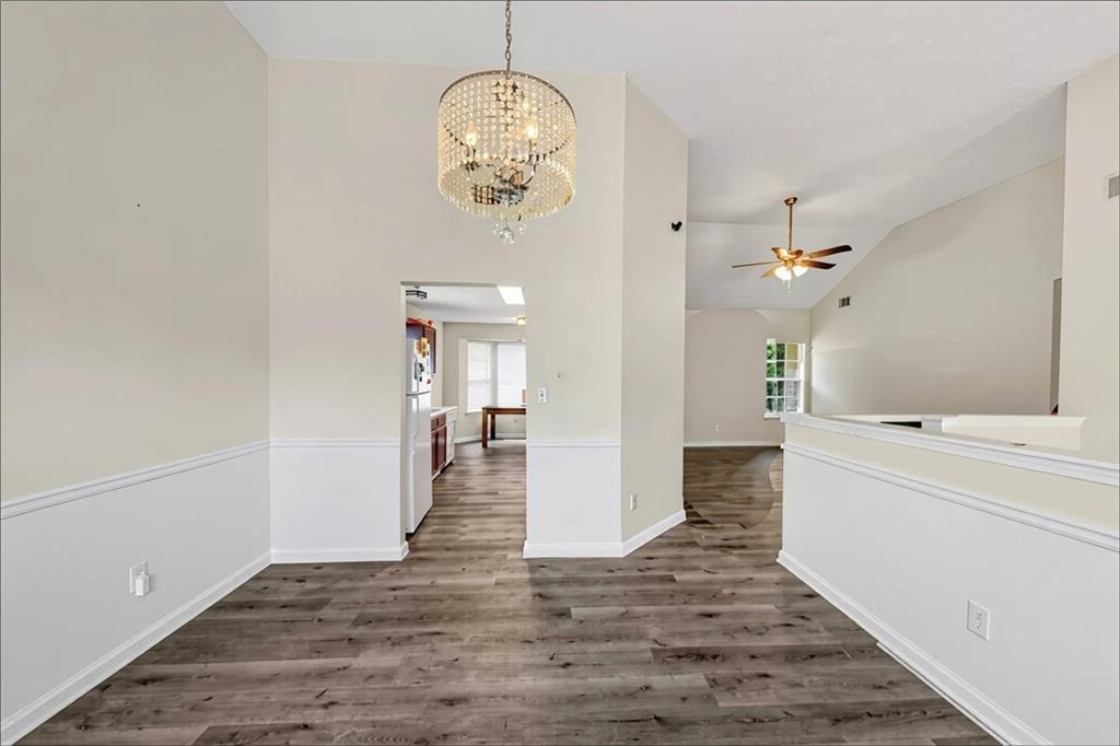 2880 Field Spring Drive Lithonia, GA 30058 - Photo 14 of 31 wooden floor in an empty room with a window