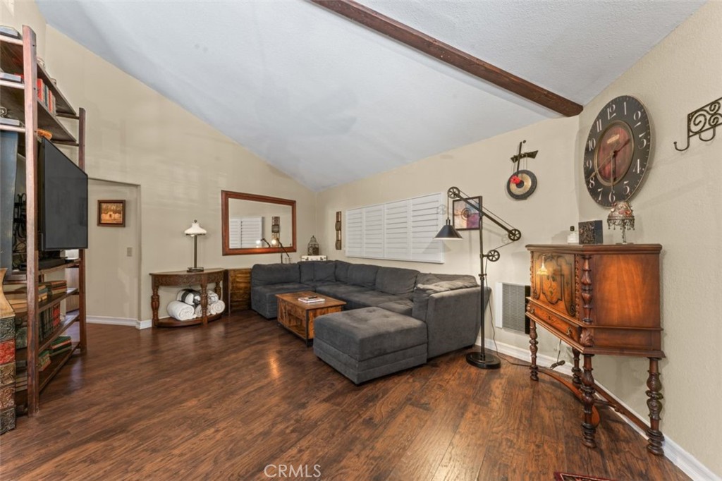 16720 Mil Potrero Frontage Road Pine Mountain Club, CA 93222 - Photo 13 of 39 a living room with furniture and a clock
