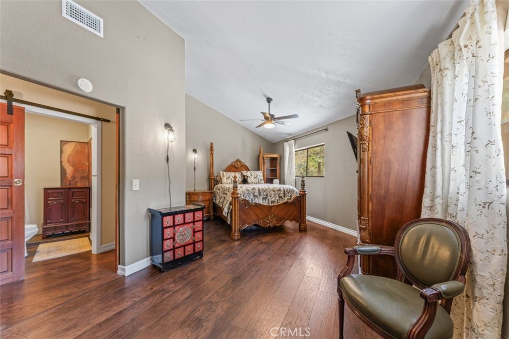 16720 Mil Potrero Frontage Road Pine Mountain Club, CA 93222 - Photo 17 of 39 a living room with furniture and a wooden floor