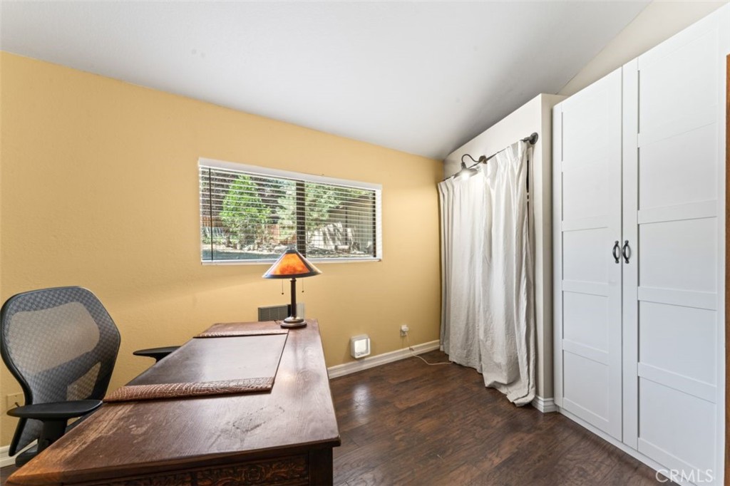 16720 Mil Potrero Frontage Road Pine Mountain Club, CA 93222 - Photo 21 of 39 a room with wooden floor and a window
