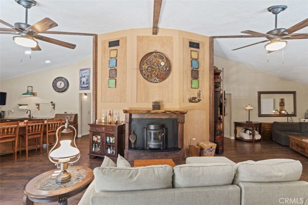 16720 Mil Potrero Frontage Road Pine Mountain Club, CA 93222 - Photo 5 of 39 a living room with furniture a clock and a large window