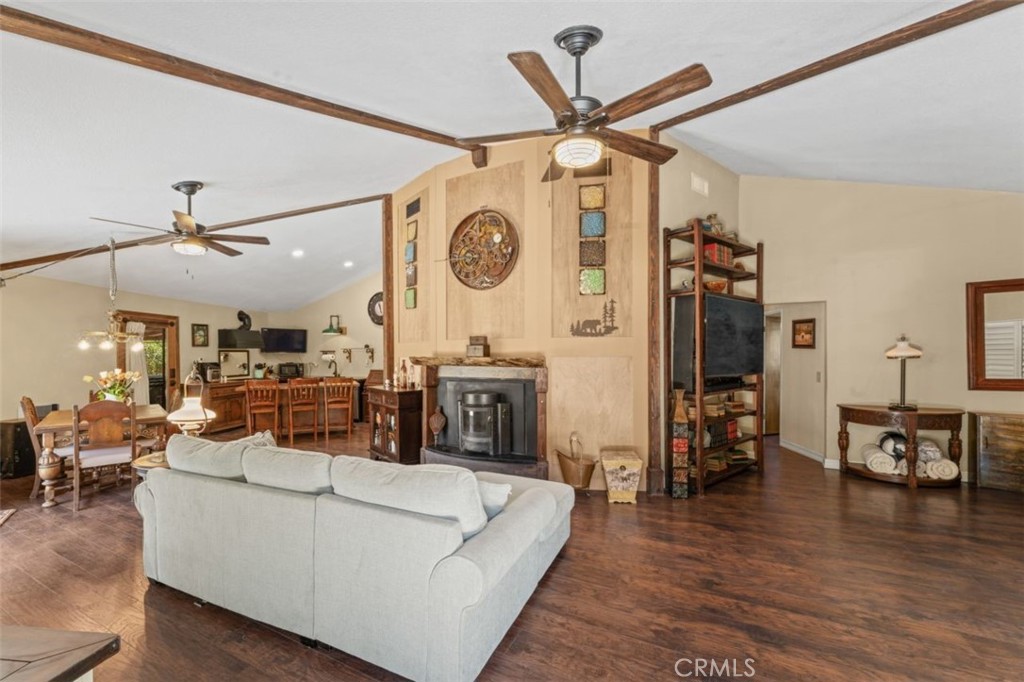 16720 Mil Potrero Frontage Road Pine Mountain Club, CA 93222 - Photo 6 of 39 a living room with furniture and a clock
