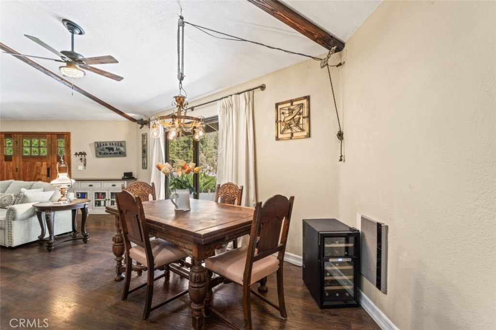 16720 Mil Potrero Frontage Road Pine Mountain Club, CA 93222 - Photo 7 of 39 a view of a dining room with furniture window and wooden floor