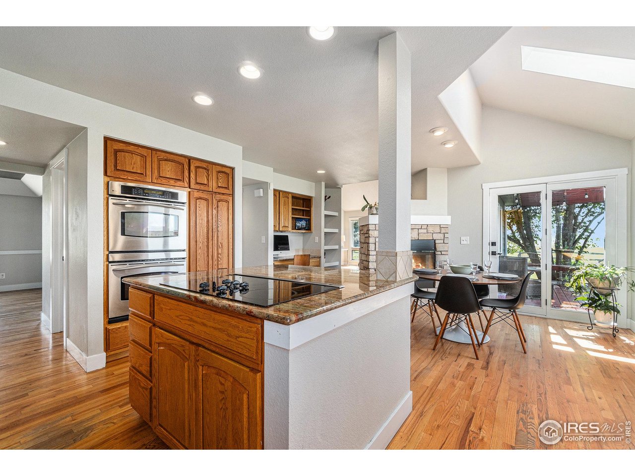 4615 Kitchell Way Fort Collins, CO 80524 - Photo 10 of 41 a kitchen with a sink and wooden floor