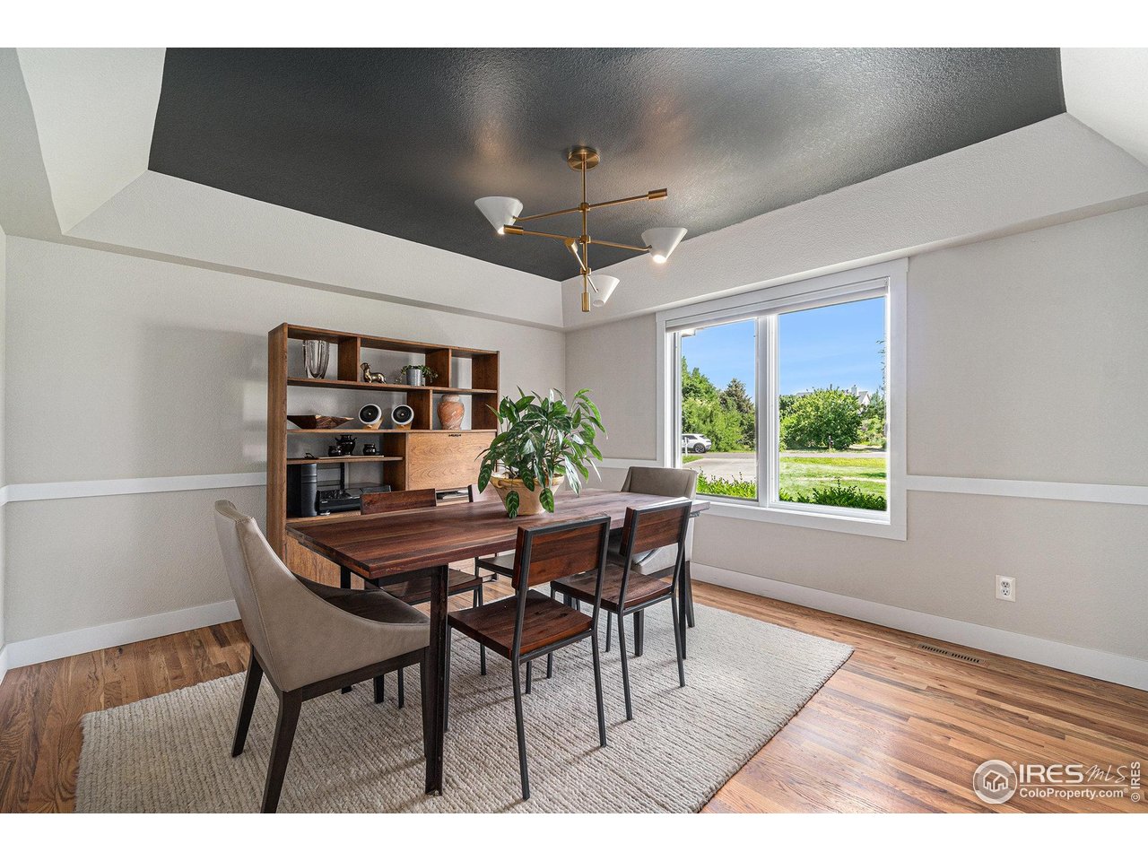 4615 Kitchell Way Fort Collins, CO 80524 - Photo 15 of 41 a view of a dining room with furniture window and outside view