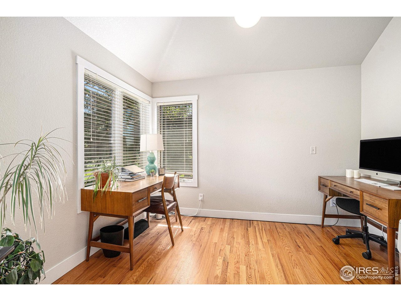 4615 Kitchell Way Fort Collins, CO 80524 - Photo 16 of 41 a workspace with furniture hardwood and a window