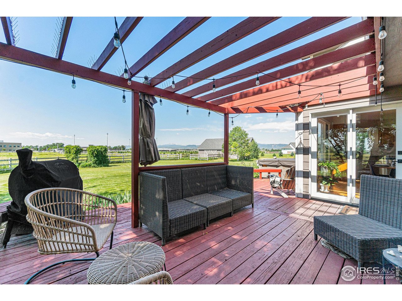 4615 Kitchell Way Fort Collins, CO 80524 - Photo 19 of 41 a balcony with furniture and wooden floor