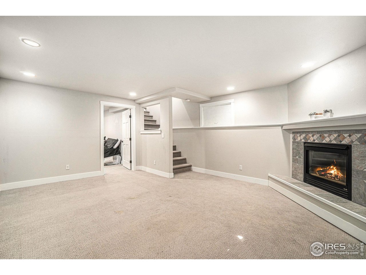 4615 Kitchell Way Fort Collins, CO 80524 - Photo 25 of 41 a view of empty room with a fireplace