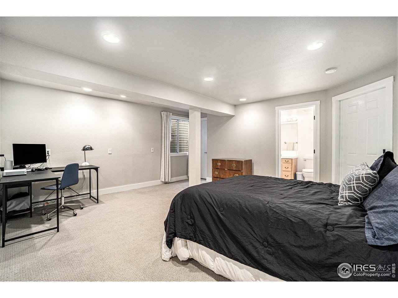 4615 Kitchell Way Fort Collins, CO 80524 - Photo 26 of 41 a bedroom with a bed and a desk