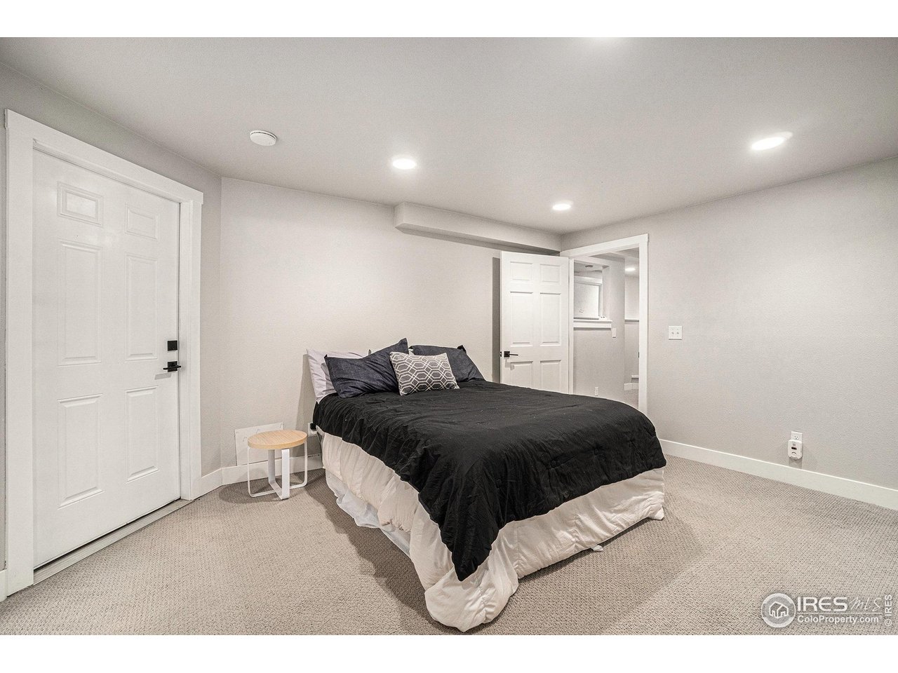 4615 Kitchell Way Fort Collins, CO 80524 - Photo 27 of 41 a bedroom with a bed and a night stand