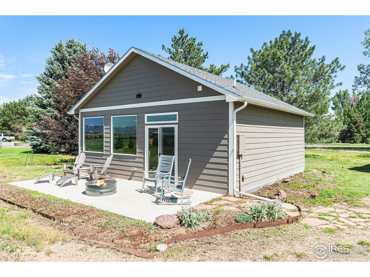 4615 Kitchell Way Fort Collins, CO 80524 - Photo 28 of 41 a view of a house with backyard and sitting area