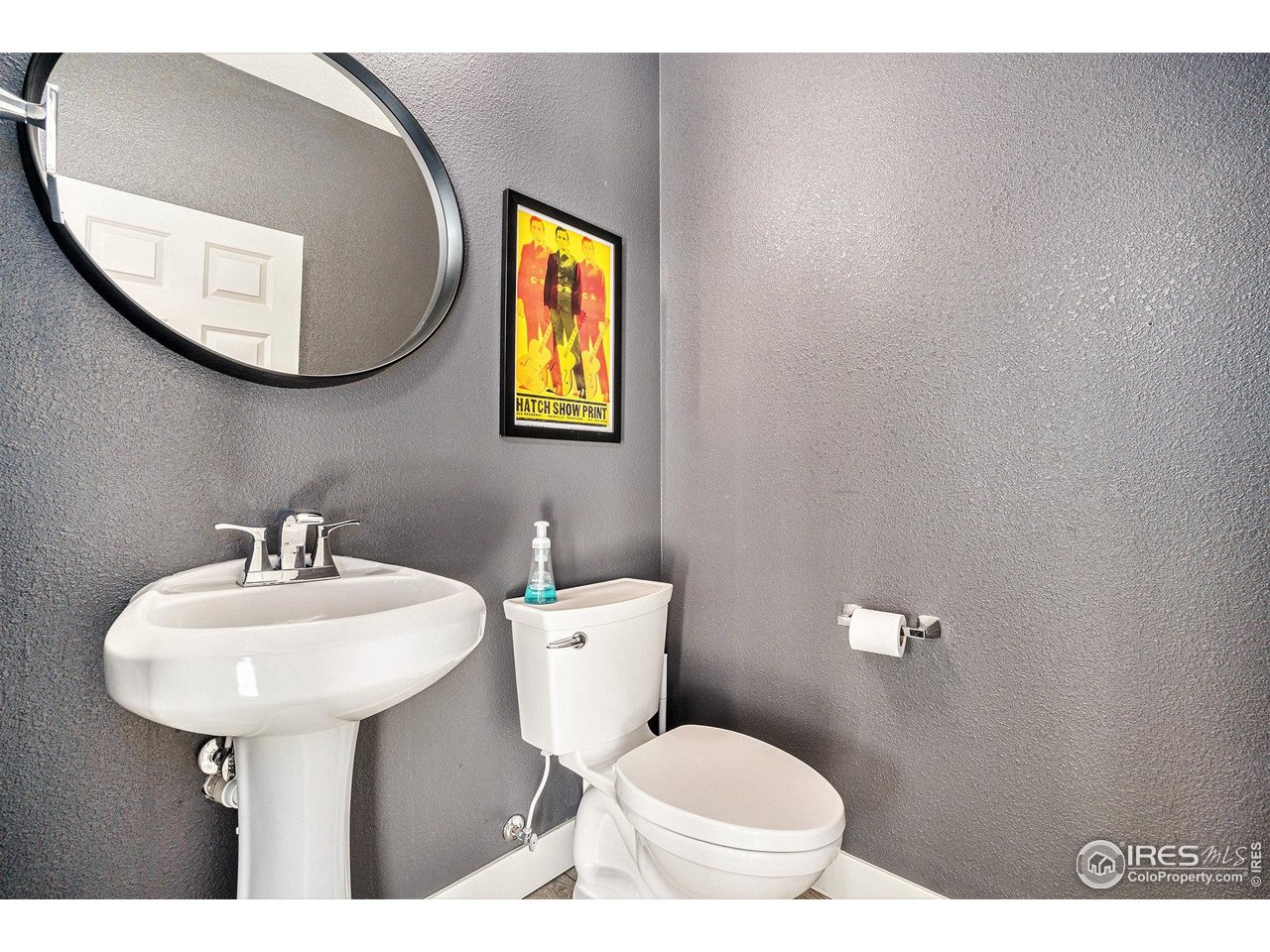 4615 Kitchell Way Fort Collins, CO 80524 - Photo 31 of 41 a bathroom with a toilet sink and mirror