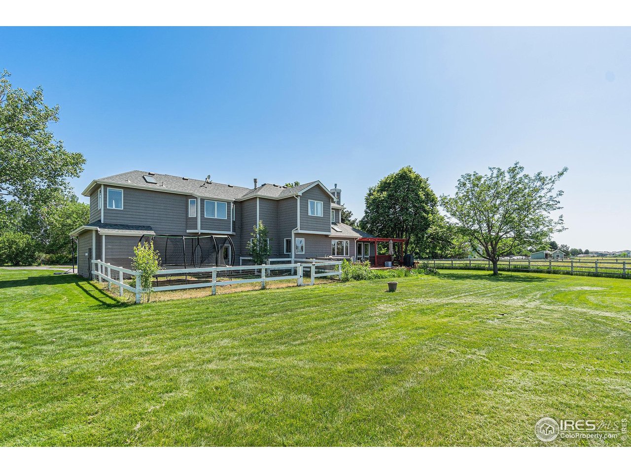 4615 Kitchell Way Fort Collins, CO 80524 - Photo 32 of 41 a swimming pool with outdoor seating and yard