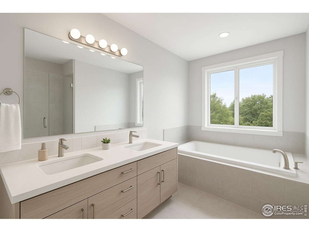 4615 Kitchell Way Fort Collins, CO 80524 - Photo 38 of 41 a bathroom with a tub a sink double vanity a mirror and a bathtub