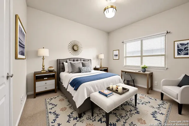 a bedroom with a bed and a couch