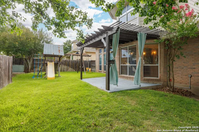 an aerial view of residential house with outdoor space and mountains