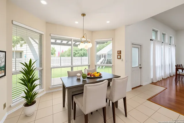 a dining room with furniture and window