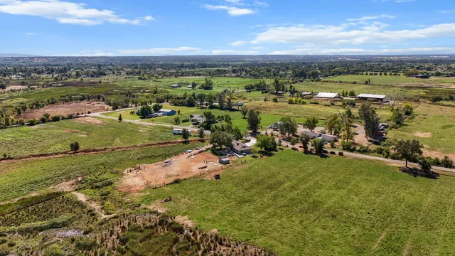 an aerial view of a houses with a lake view