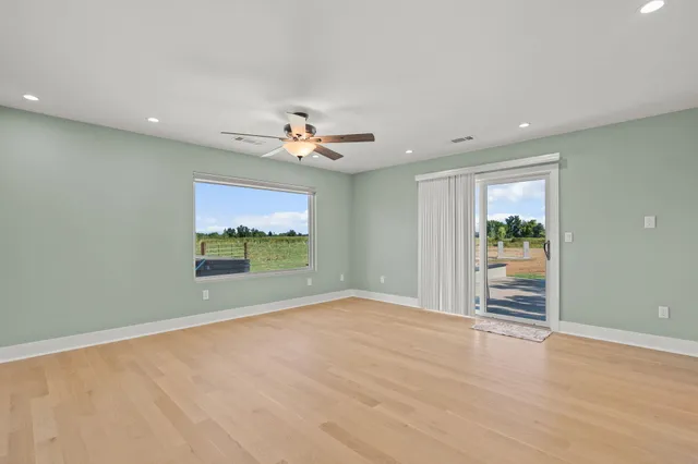 a view of an empty room with a window