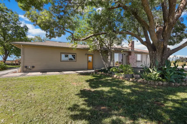 a house view with a garden space