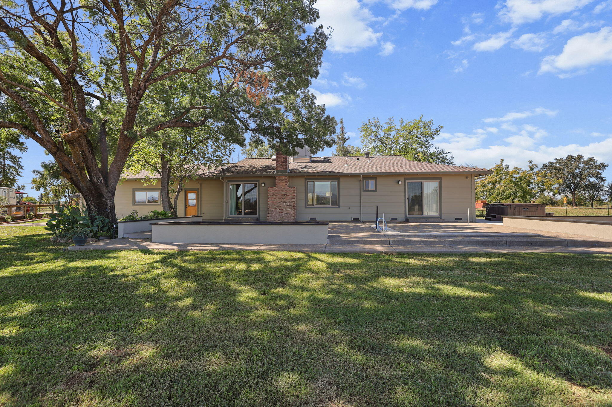 4315 Webb Road Anderson, CA 96007 - Photo 45 of 49 a front view of a house with a yard garage and outdoor seating