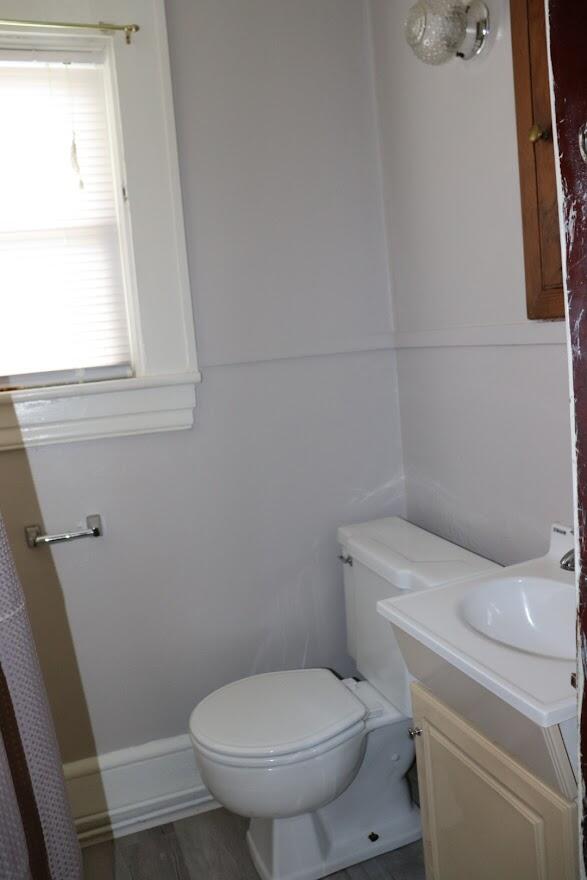 7760 Williamson Road Roanoke, VA 24019 - Photo 4 of 16 a white toilet sitting next to a window