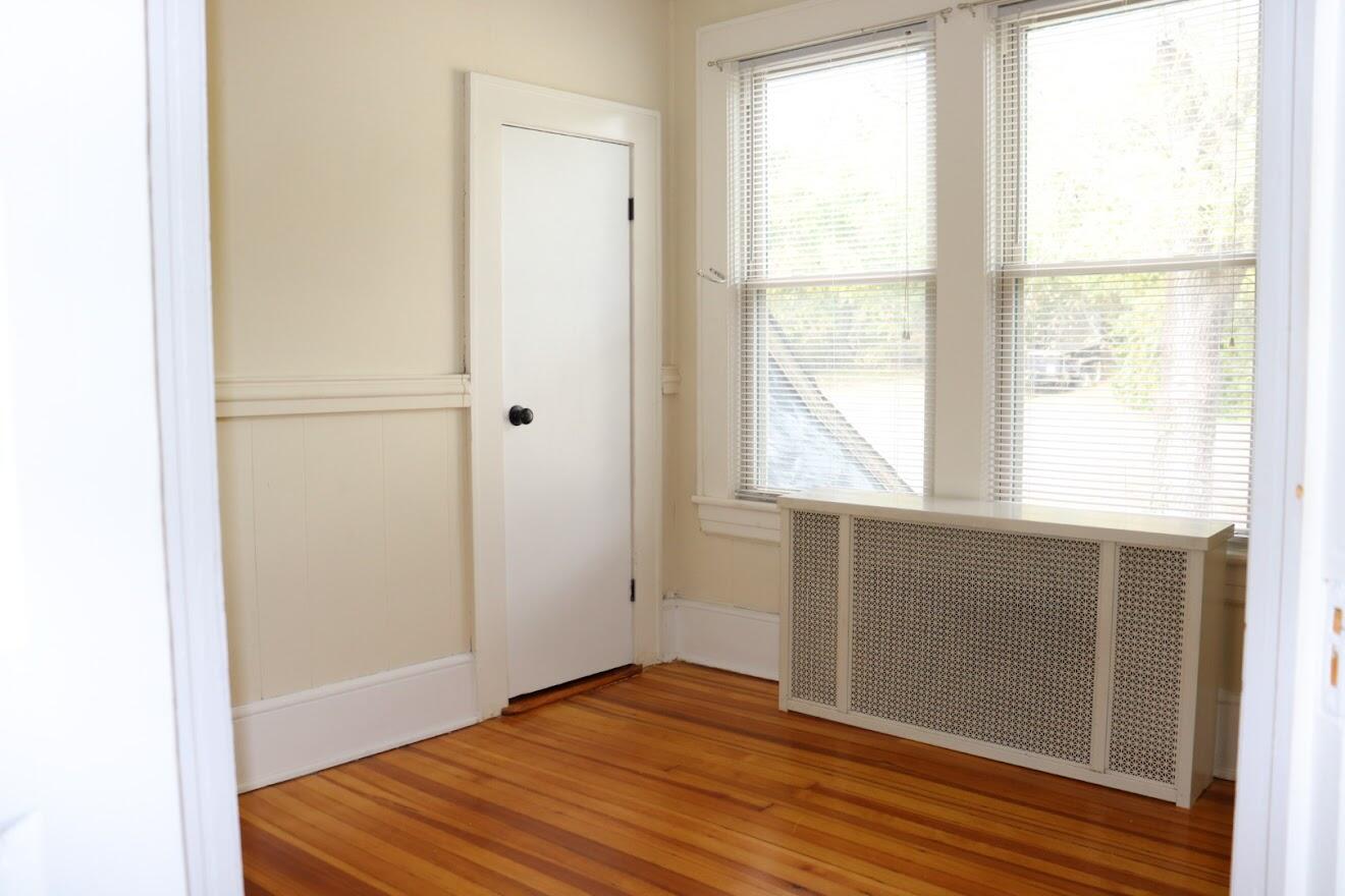 7760 Williamson Road Roanoke, VA 24019 - Photo 5 of 16 a view of empty room with wooden floor and fan