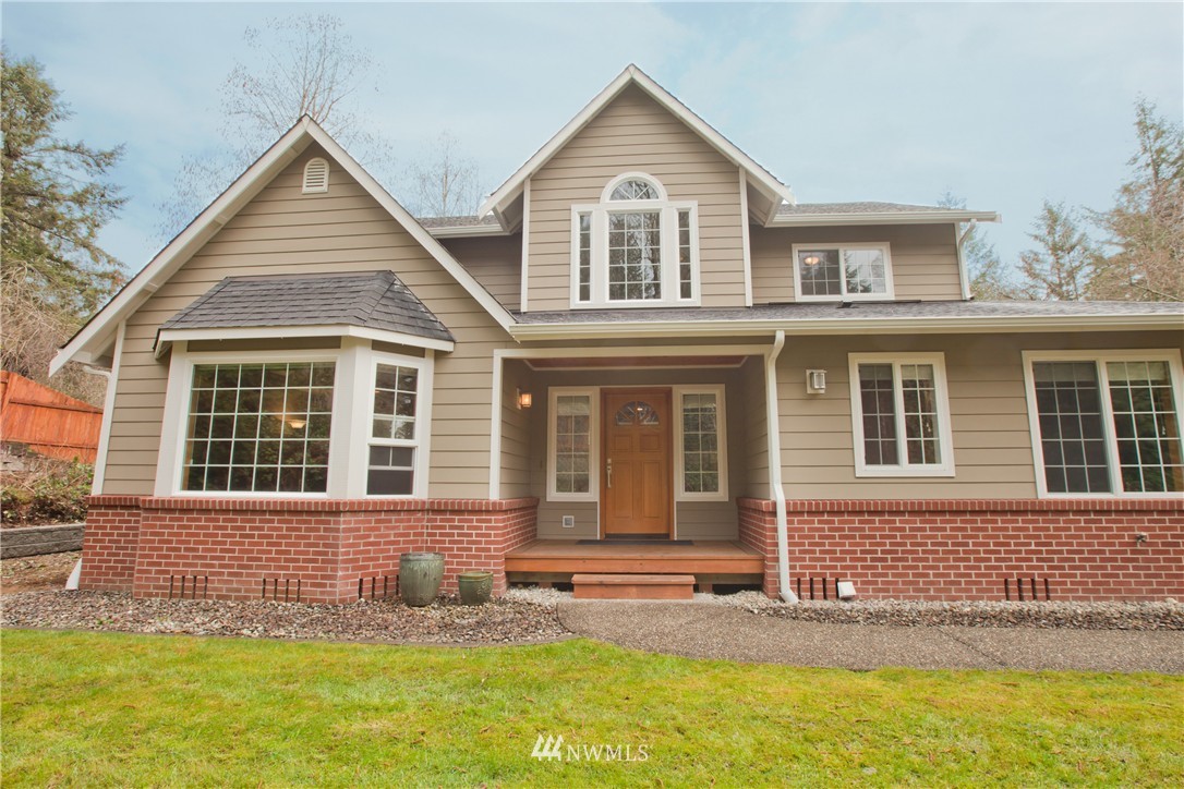 front view of a house with a yard