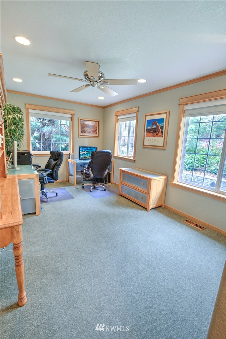 7736 Fairview Road Southwest Tumwater, WA 98512 - Photo 13 of 25 a living room with furniture and a large window