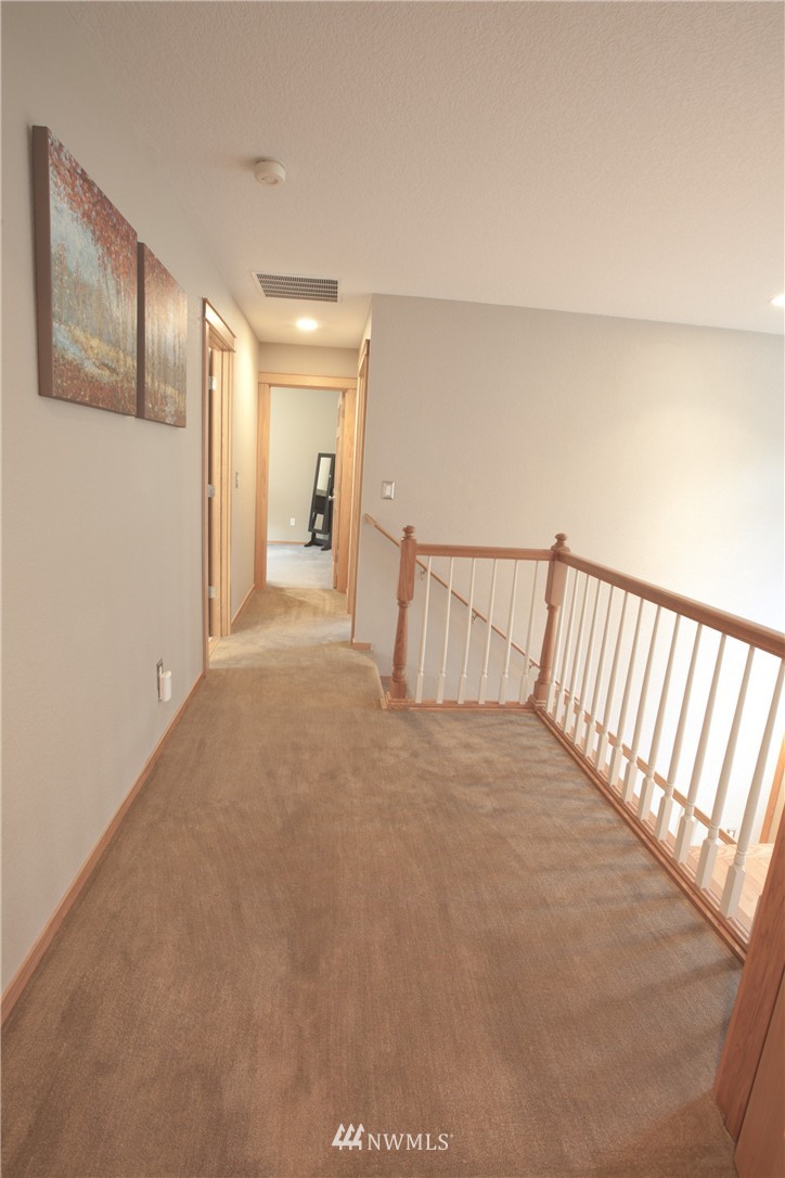 7736 Fairview Road Southwest Tumwater, WA 98512 - Photo 15 of 25 a view of a hallway