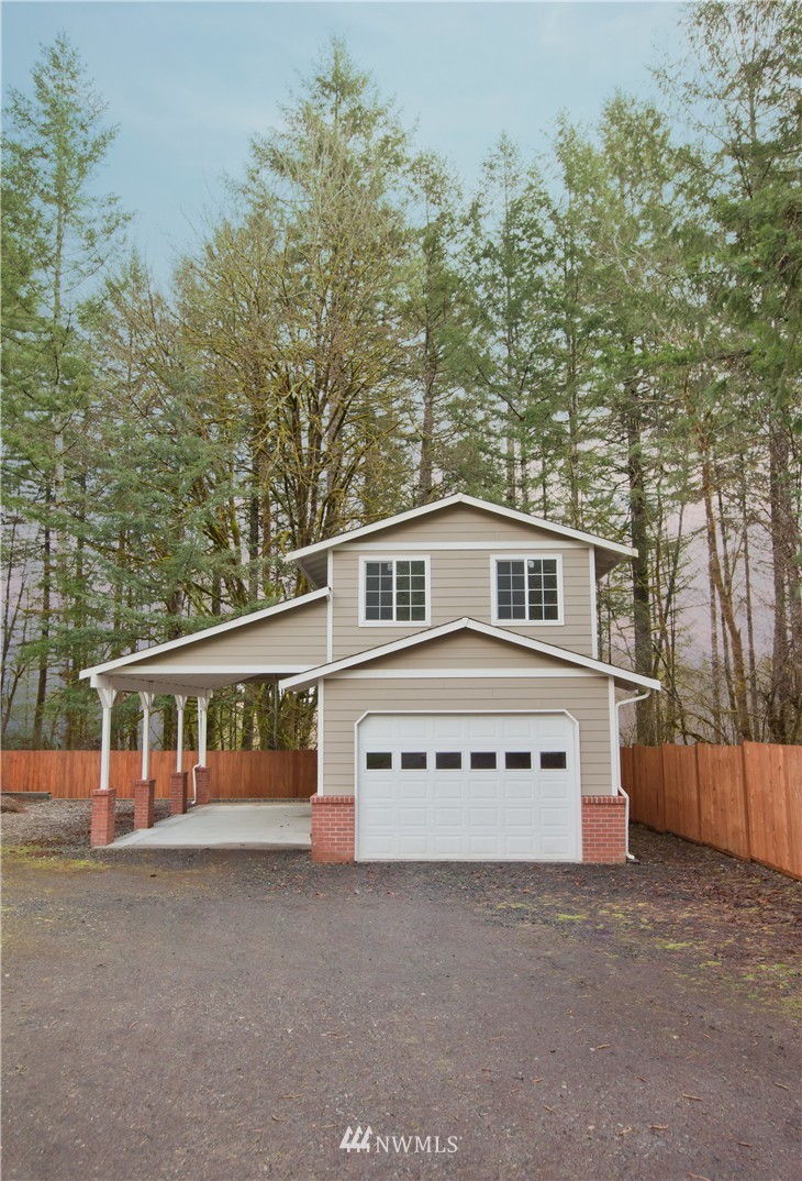 7736 Fairview Road Southwest Tumwater, WA 98512 - Photo 23 of 25 a view of a house with a large trees