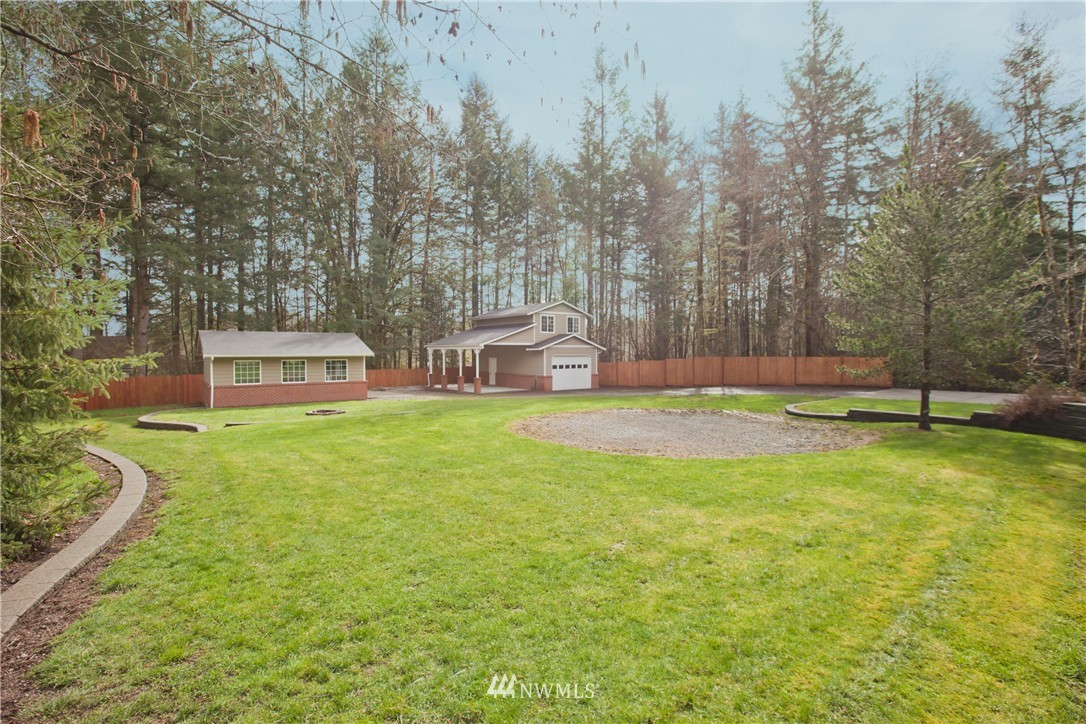 7736 Fairview Road Southwest Tumwater, WA 98512 - Photo 25 of 25 a view of a house with a yard