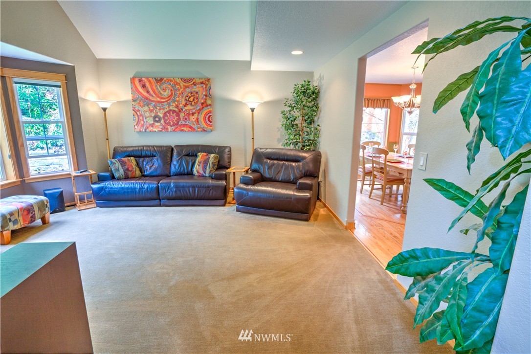 7736 Fairview Road Southwest Tumwater, WA 98512 - Photo 4 of 25 a living room with furniture and a potted plant